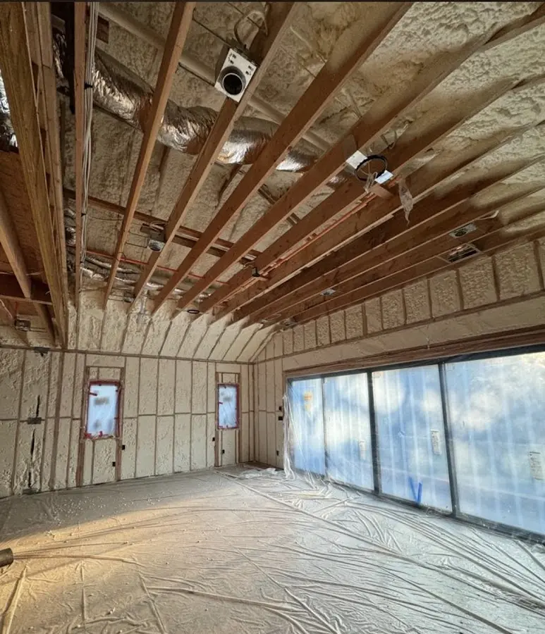 Interior walls and ceiling insulated with spray foam during new construction in Danville